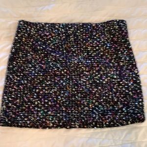 XXI marked black multi colored mini skirt. Size L.